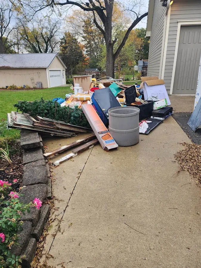 Dumpster being loaded with debris for Estate Cleanout Dumpster Rental in Parkersburg